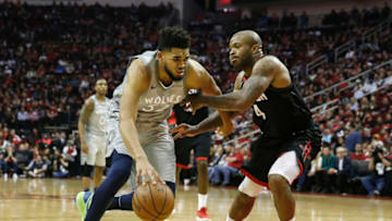 HOUSTON, TX - APRIL 15: Karl-Anthony Towns #32 of the Minnesota Timberwolves drives to the basket defended by PJ Tucker #4 of the Houston Rockets. (Photo by Tim Warner/Getty Images)