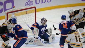 Feb 13, 2021; Uniondale, New York, USA; New York Islanders goalie Semyon Varlamov (40) makes a save against Boston Bruins center Charlie Coyle (13) during the third period at Nassau Veterans Memorial Coliseum. Mandatory Credit: Brad Penner-USA TODAY Sports