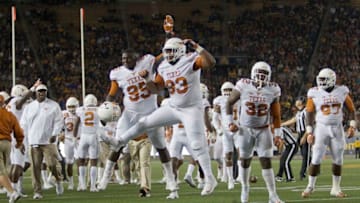BERKELEY, CA - SEPTEMBER 17: Defensive tackle Paul Boyette Jr. #93 and defensive tackle Poona Ford #95 of the Texas Longhorns celebrate stopping the California Golden Bears on fourth and one in the first quarter on September 17, 2016 at California Memorial Stadium in Berkeley, California. Cal won 50-43. (Photo by Brian Bahr/Getty Images)