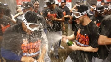 Sep 26, 2015; Cincinnati, OH, USA; The New York Mets celebrate in the clubhouse after clinching the National League East Championship at Great American Ball Park. The Mets beat the Cincinnati Reds 10-2. Mandatory Credit: David Kohl-USA TODAY Sports