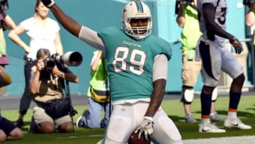 MIAMI GARDENS , FL - DECEMBER 3: Tight end Julius Thomas #89 of the Miami Dolphins riding the bucking bronco after a touchdown catch in the first half as the Broncos lose 35-9 at the Miami Dolphins at Hard Rock Stadium in Miami Gardens, Florida December 3, 2017. (Photo by Joe Amon/The Denver Post via Getty Images)