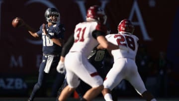 TUCSON, AZ - DECEMBER 29: Quarterback Jordan Love #10 of the Utah State Aggies looks to pass during the first half of the Nova Home Loans Arizona Bowl game against the New Mexico State Aggies at Arizona Stadium on December , 29017 in Tucson, Arizona. (Photo by Christian Petersen/Getty Images)