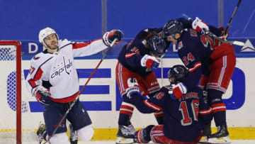 NEW YORK, NEW YORK - FEBRUARY 04: (l-r) Artemi Panarin #10, Ryan Strome #16 and Kaapo Kakko #24 of the New York Rangers celebrates Strome's goal at 7:55 of the third period against Trevor van Riemsdyk #57 and the Washington Capitals at Madison Square Garden on February 04, 2021 in New York City. (Photo by Bruce Bennett/Getty Images)