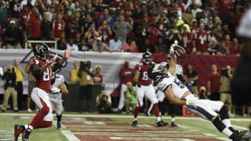 Sep 14, 2015; Atlanta, GA, USA; Philadelphia Eagles linebacker Kiko Alonso (50) intercepts a pass intended for Atlanta Falcons wide receiver Roddy White (84) in the first quarter at the Georgia Dome. Mandatory Credit: Dale Zanine-USA TODAY Sports