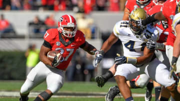 Nov 26, 2016; Athens, GA, USA; Georgia football running back Nick Chubb (27) runs against Georgia Tech Yellow Jackets defensive end Rod Rook-Chungong (41) during the first half at Sanford Stadium. Georgia Tech defeated Georgia 28-27. Mandatory Credit: Dale Zanine-USA TODAY Sports