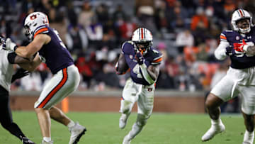 Auburn footballNov 19, 2022; Auburn, Alabama, USA; Auburn Tigers running back Tank Bigsby (4) runs through a hole during the third quarter against the Western Kentucky Hilltoppers at Jordan-Hare Stadium. Mandatory Credit: John Reed-USA TODAY Sports