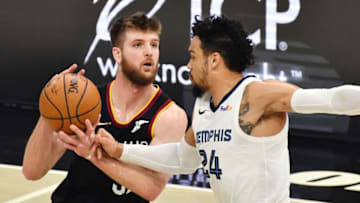 Jan 11, 2021; Cleveland, Ohio, USA; Memphis Grizzlies guard Dillon Brooks (24) defends Cleveland Cavaliers forward Dean Wade (32) during the second quarter at Rocket Mortgage FieldHouse. Mandatory Credit: Ken Blaze-USA TODAY Sports