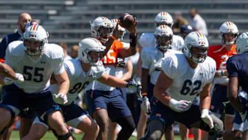 Auburn football quarterback Chayil Garnett (15) hikes the ball during an open football practice at Jordan-Hare Stadium in Auburn, Ala., on Saturday, March 20, 2021.