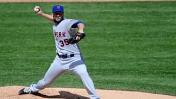 May 4, 2014; Denver, CO, USA; New York Mets starting pitcher Dillon Gee (35) prepares to pitch in the fifth inning against the Colorado Rockies at Coors Field. Mandatory Credit: Ron Chenoy-USA TODAY Sports