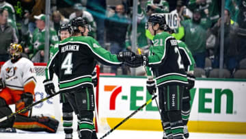 Dec 1, 2022; Dallas, Texas, USA; Dallas Stars left wing Jason Robertson (21) and defenseman Miro Heiskanen (4) celebrates after Robertson scores his third goal of the game during the third period for a hat trick against the Anaheim Ducks at the American Airlines Center. Mandatory Credit: Jerome Miron-USA TODAY Sports