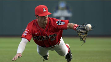 Jun 22, 2016; Omaha, NE, USA; Arizona Wildcats shortstop Louis Boyd (5) cannot field a grounder in the fifth inning against the UC Santa Barbara Gauchos in the 2016 College World Series at TD Ameritrade Park. Arizona won 3-0. Mandatory Credit: Bruce Thorson-USA TODAY Sports