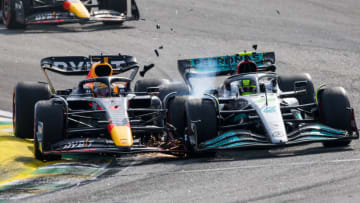 SAO PAULO, BRAZIL - NOVEMBER 13: Max Verstappen of Red Bull Racing and The Netherlands and Lewis Hamilton of Mercedes and Great Britain clash at turn 2 during the F1 Grand Prix of Brazil at Autodromo Jose Carlos Pace on November 13, 2022 in Sao Paulo, Brazil. (Photo by Peter J Fox/Getty Images )