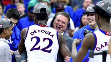 Silvio De Sousa (22) receives a big hug from Kansas head coach Bill Self after an 81-70 win against West Virginia in the Big 12 Tournament championship game at the Sprint Center in Kansas City, Mo., on Saturday, March 10, 2018. (Rich Sugg/Kansas City Star/TNS via Getty Images)