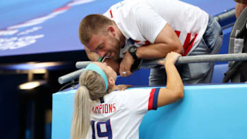 LYON, FRANCE - JULY 07: Julie Ertz of the USA celebrates with her husband, NFL player Zach Ertz, following USA's victory in the 2019 FIFA Women's World Cup France Final match between The United States of America and The Netherlands at Stade de Lyon on July 07, 2019 in Lyon, France. (Photo by Elsa/Getty Images)