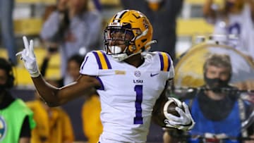 BATON ROUGE, LOUISIANA - OCTOBER 24: Eli Ricks #1 of the LSU Tigers gestures while scoring a touchdown on an interception during a game against the South Carolina Gamecocks at Tiger Stadium on October 24, 2020 in Baton Rouge, Louisiana. (Photo by Jonathan Bachman/Getty Images)