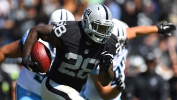 Sep 25, 2016; Nashville, TN, USA; Oakland Raiders running back Latavius Murray (28) carries the ball to score a touchdown during the first half against the Tennessee Titans at Nissan Stadium. Mandatory Credit: Christopher Hanewinckel-USA TODAY Sports
