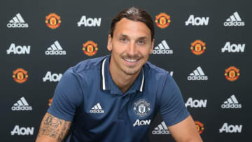 MANCHESTER, ENGLAND - JULY 01: (MINIMUM FEES APPLY - MINIMUM PRINT/BROADCAST FEE OF 150 GBP, ONLINE FEE OF 75 GBP, OR LOCAL EQUIVALENT) (EXCLUSIVE COVERAGE) Zlatan Ibrahimovic of Manchester United poses after signing for the club at Aon Training Complex on July 1, 2016 in Manchester, England. (Photo by John Peters/Man Utd via Getty Images)