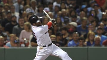 Aug 27, 2016; Boston, MA, USA; Boston Red Sox second baseman Dustin Pedroia (15) hits an RBI single during the fourth inning against the Kansas City Royals at Fenway Park. Mandatory Credit: Bob DeChiara-USA TODAY Sports