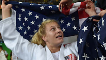 US Kayla Harrison celebrates after defeating France's Audrey Tcheumeo during their women's -78kg judo contest gold medal match of the Rio 2016 Olympic Games in Rio de Janeiro on August 11, 2016. / AFP / Toshifumi KITAMURA (Photo credit should read TOSHIFUMI KITAMURA/AFP via Getty Images)