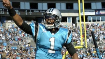 Nov 3, 2013; Charlotte, NC, USA; Carolina Panthers quarterback Cam Newton (1) celebrates after a touchdown during the game against the Atlanta Falcons at Bank of America Stadium. Mandatory Credit: Sam Sharpe-USA TODAY Sports
