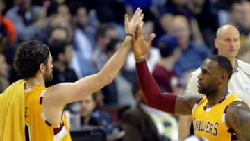 Jan 30, 2016; Cleveland, OH, USA; Cleveland Cavaliers forward LeBron James (23) and forward Kevin Love (0) celebrate in the fourth quarter against the San Antonio Spurs at Quicken Loans Arena. Mandatory Credit: David Richard-USA TODAY Sports