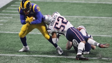 ATLANTA, GA - FEBRUARY 03: C.J. Anderson #35 of the Los Angeles Rams runs the ball against Elandon Roberts #52 of the New England Patriots in the second half during Super Bowl LIII at Mercedes-Benz Stadium on February 3, 2019 in Atlanta, Georgia. (Photo by Elsa/Getty Images)