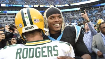 Nov 8, 2015; Charlotte, NC, USA; Green Bay Packers quarterback Aaron Rodgers (12) with Carolina Panthers quarterback Cam Newton (1) after the game. The Panthers defeated the Packers 37-29 at Bank of America Stadium. Mandatory Credit: Bob Donnan-USA TODAY Sports