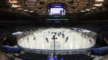 fans watch warm-ups prior to the game between the New York Rangers and the Boston Bruins at Madison Square Garden. (Photo by Bruce Bennett/Getty Images)