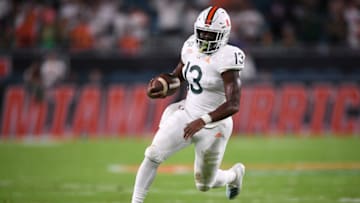 MIAMI, FLORIDA - OCTOBER 11: DeeJay Dallas #13 of the Miami Hurricanes runs for touchdown against the Virginia Cavaliers in the first half at Hard Rock Stadium on October 11, 2019 in Miami, Florida. (Photo by Mark Brown/Getty Images)