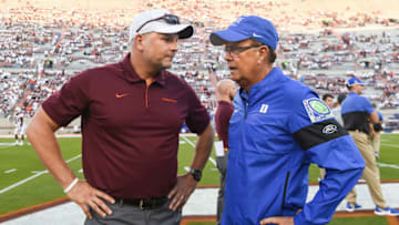 Duke football coach David Cutcliffe greets Virginia Tech head coach Justin Fuente. (Photo by Michael Shroyer/Getty Images)