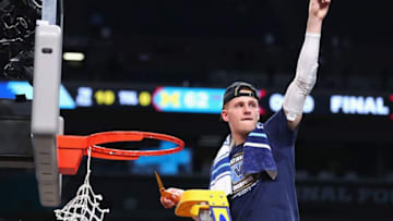 SAN ANTONIO, TX - APRIL 02: Donte DiVincenzo #10 of the Villanova Wildcats cuts down the net after defeating the Michigan Wolverines during the 2018 NCAA Men's Final Four National Championship game at the Alamodome on April 2, 2018 in San Antonio, Texas. Villanova defeated Michigan 79-62. (Photo by Tom Pennington/Getty Images)