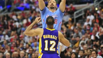 April 6, 2014; Los Angeles, CA, USA; Los Angeles Clippers forward Hedo Turkoglu (8) attempts a shot against Los Angeles Lakers guard Kendall Marshall (12) during the second half at Staples Center. Mandatory Credit: Gary A. Vasquez-USA TODAY Sports