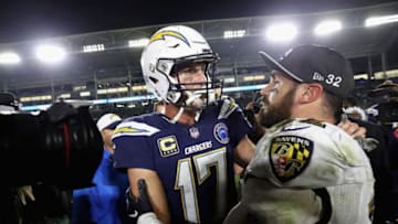 CARSON, CA - DECEMBER 22: Philip Rivers #17 of the Los Angeles Chargers talks with Eric Weddle #32 of the Baltimore Ravens after a game at StubHub Center on December 22, 2018 in Carson, California. The Baltimore Ravens defeated the Los Angeles Chargers 22-10. (Photo by Sean M. Haffey/Getty Images)