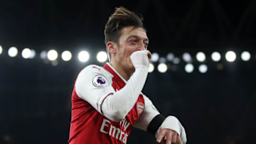 LONDON, ENGLAND - NOVEMBER 29: Mesut Ozil of Arsenal celebrates after scoring his sides fourth goal during the Premier League match between Arsenal and Huddersfield Town at Emirates Stadium on November 29, 2017 in London, England. (Photo by Julian Finney/Getty Images)