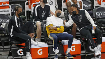 SAN ANTONIO, TX - APRIl 22: DeMar DeRozan #10 of the San Antonio Spurs, Dejounte Murray #5, and Patty Mills (Photo by Ronald Cortes/Getty Images)