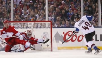 Feb 27, 2016; Denver, CO, USA; Colorado Avalanche left wing Alex Tanguay (40) scores a goal past Detroit Red Wings goalie Petr Mrazek (34) in the third period during a Stadium Series hockey game at Coors Field. Mandatory Credit: Isaiah J. Downing-USA TODAY Sports