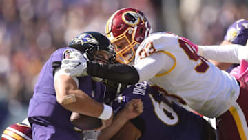 BALTIMORE, MD - OCTOBER 09: Trent Murphy #93 of the Washington Redskins sacks Joe Flacco #5 of the Baltimore Ravens in the third quarter during a football game at M&T Bank Stadium on October 9, 2016 in Baltimore, Maryland. (Photo by Mitchell Layton/Getty Images)