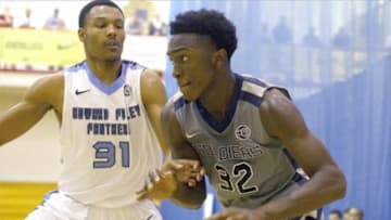 Jul 13, 2013; North Augusta, SC, USA; Oakland Soldiers player Stanley Johnson (32) drives toward the basket while being defended by Howard Pulley Panthers player James Lawson (31) at the Riverview Park Activities Center during the Nike Peach Jam. Mandatory Credit: Joshua S. Kelly-USA TODAY Sports