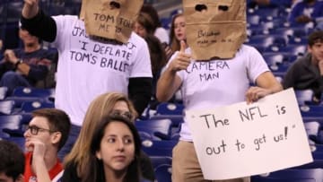 Oct 18, 2015; Indianapolis, IN, USA; Indianapolis Colts fans hold up signs referring to Deflategate during a game against the New England Patriots at Lucas Oil Stadium. Mandatory Credit: Brian Spurlock-USA TODAY Sports