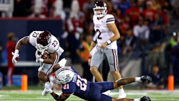 Sep 10, 2022; Tucson, Arizona, USA; Mississippi State Bulldogs running back Dillon Johnson (23) runs the ball against Arizona Wildcats safety Jaxen Turner (21) during the first half at Arizona Stadium. Mandatory Credit: Mark J. Rebilas-USA TODAY Sports