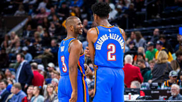 DECEMBER 9: Shai Gilgeous-Alexander #2 and Chris Paul #3 of the OKC Thunder smile and talk during the game against the Utah Jazz (Photo by Zach Beeker/NBAE via Getty Images)