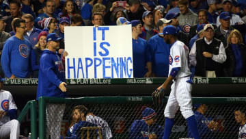 Oct 22, 2016; Chicago, IL, USA; Chicago Cubs fans hold up a sign as center fielder Dexter Fowler (24) walks back to the dugout during the fourth inning of game six of the 2016 NLCS playoff baseball series against the Los Angeles Dodgers at Wrigley Field. Mandatory Credit: Jerry Lai-USA TODAY Sports