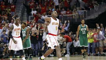 Apr 26, 2016; Atlanta, GA, USA; Atlanta Hawks forward Paul Millsap (4) and guard Dennis Schroder (17) react against the Boston Celtics in the third quarter in game five of the first round of the NBA Playoffs at Philips Arena. The Hawks defeated the Celtics 110-83. Mandatory Credit: Brett Davis-USA TODAY Sports