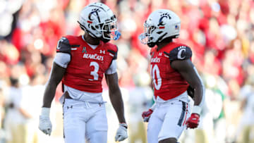 Cincinnati Bearcats safety Ja'von Hicks and cornerback Bryon Threats against the South Florida Bulls at Nippert Stadium. USA Today.