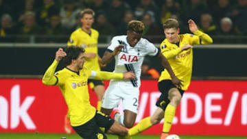 DORTMUND, GERMANY - MARCH 10: Joshua Onomah of Tottenham Hotspur is challenged by Mats Hummels (L) and Lukasz Piszczek of Borussia Dortmund (R) during the UEFA Europa League Round of 16 first leg match between Borussia Dortmund and Tottenham Hotspur at Signal Iduna Park on March 10, 2016 in Dortmund, Germany. (Photo by Alex Grimm/Bongarts/Getty Images)