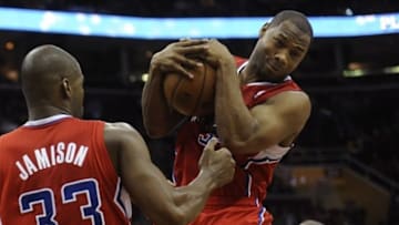 Dec 7, 2013; Cleveland, OH, USA; Los Angeles Clippers shooting guard Willie Green (right) grabs a rebound beside power forward Antawn Jamison (33) in the fourth quarter against the Cleveland Cavaliers at Quicken Loans Arena. Mandatory Credit: David Richard-USA TODAY Sports