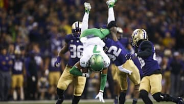 Oct 17, 2015; Seattle, WA, USA; Oregon Ducks wide receiver Darren Carrington (7) is tackled by Washington Huskies defensive back Budda Baker (32) during the third quarter at Husky Stadium. Mandatory Credit: Jennifer Buchanan-USA TODAY Sports