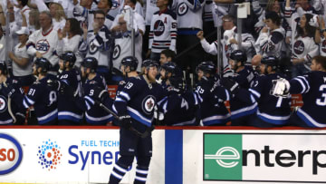 WINNIPEG, MB - MAY 12: Patrik Laine #29 of the Winnipeg Jets is congratulated by his teammates after scoring a first period goal against the Vegas Golden Knights in Game One of the Western Conference Finals during the 2018 NHL Stanley Cup Playoffs at Bell MTS Place on May 12, 2018 in Winnipeg, Canada. (Photo by Elsa/Getty Images)
