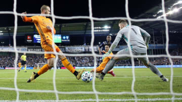 KANSAS CITY, KANSAS - MARCH 07: Goalkeeper Marko Maric #1 and Aljaz Struna #5 of Houston Dynamo let in a goal by Gadi Kinda #17 of Sporting Kansas City during the game at Children's Mercy Park on March 07, 2020 in Kansas City, Kansas. (Photo by Jamie Squire/Getty Images)