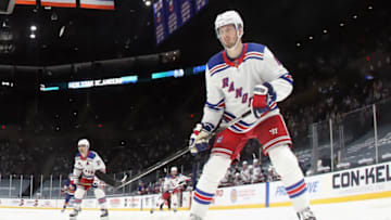 UNIONDALE, NEW YORK - APRIL 09: Jacob Trouba #8 of the New York Rangers skates against the New York Islanders at Nassau Coliseum on April 09, 2021 in Uniondale, New York. (Photo by Bruce Bennett/Getty Images)